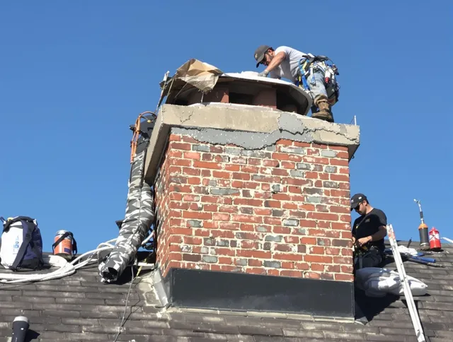 Miami Beach Chimney Sweep installing a custom chimney crown in Miami Beach, FL
